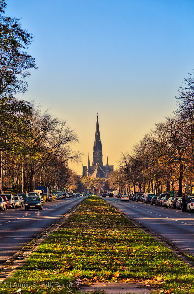 street in Berlin Kreuzberg, sunset and church