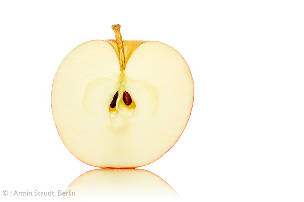 close up of a half of an apple, isolated on white