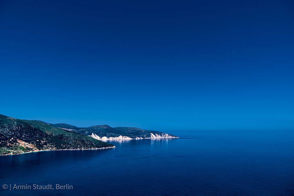 mediterranean landscape, promontory in the deep blue sea