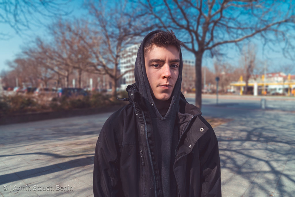 portrait of a serious young man with hoodie